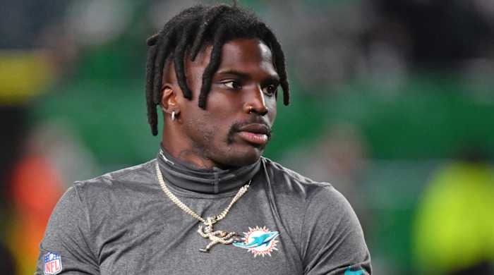 Dolphins receiver Tyreek Hill warms up before a game.